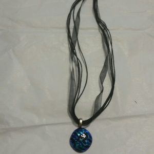 Blue green and black pendant with black necklace